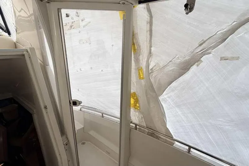  Yacht Photos Pics 2006 Carver 41 Cockpit Motor Yacht interior with protective covering.