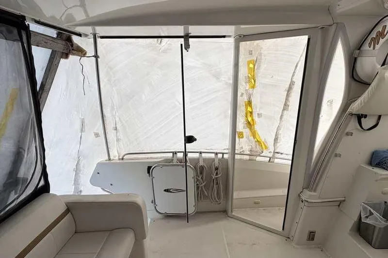  Yacht Photos Pics Interior view of 2006 Carver 41 Cockpit Motor Yacht, featuring seating and enclosed cockpit.