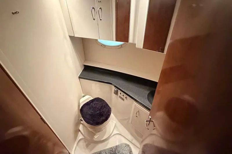  Yacht Photos Pics 2006 Carver 41 Cockpit Motor Yacht bathroom with modern fixtures and storage cabinets.