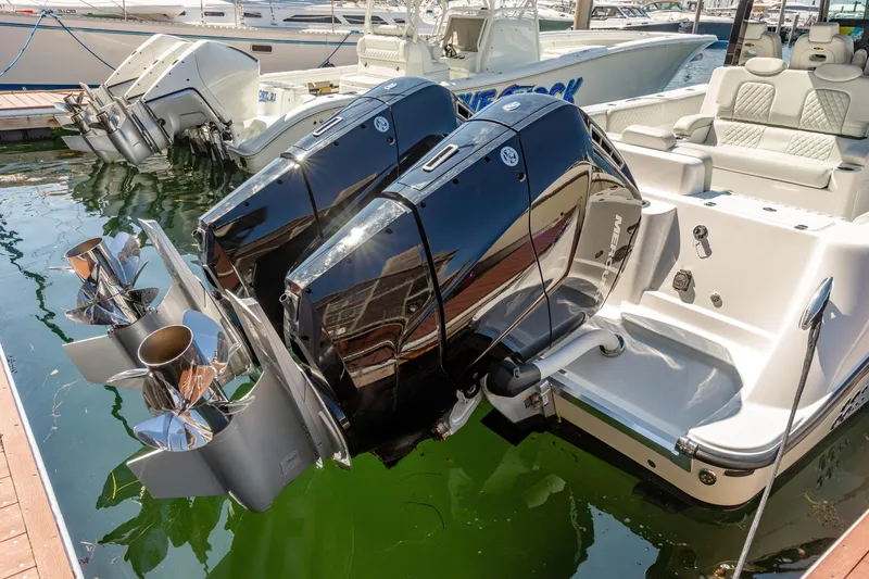  Yacht Photos Pics 2024 HCB 39 Speciale boat with dual outboard engines docked.