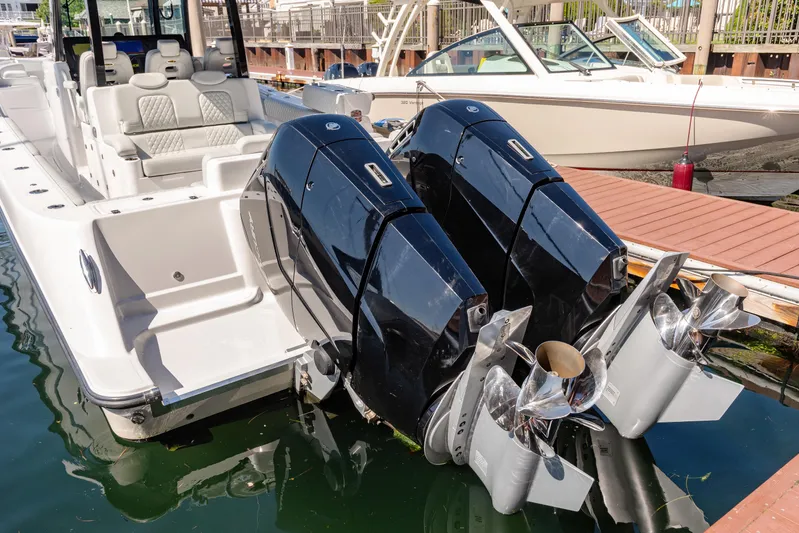  Yacht Photos Pics 2024 HCB 39 Speciale boat with dual outboard engines docked.
