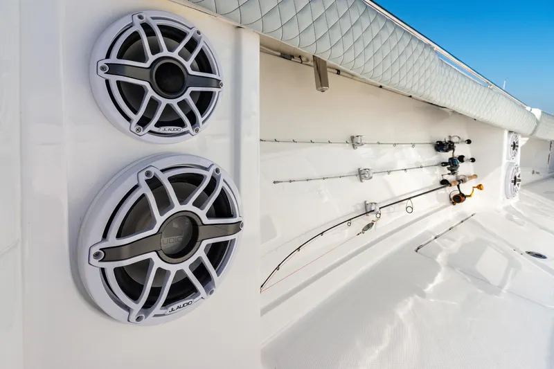  Yacht Photos Pics 2024 HCB 39 Speciale boat with mounted speakers and fishing rods.