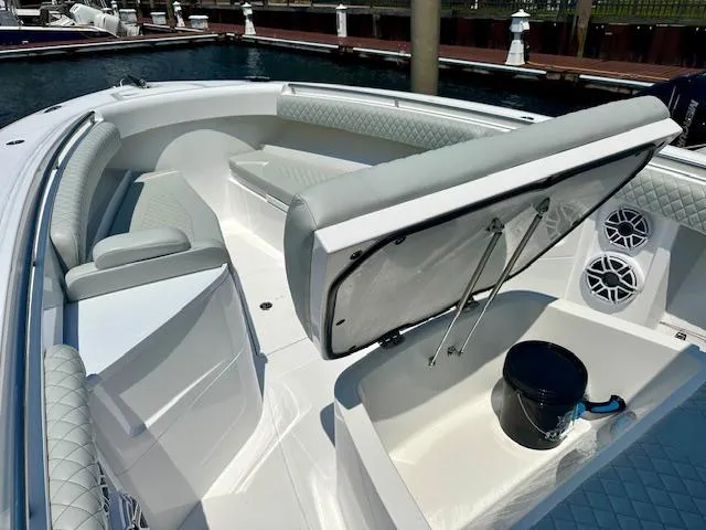  Yacht Photos Pics 2024 HCB 39 Speciale boat interior with seating and storage at marina.