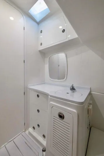  Yacht Photos Pics 2024 HCB 39 Speciale boat bathroom with white cabinetry and skylight.