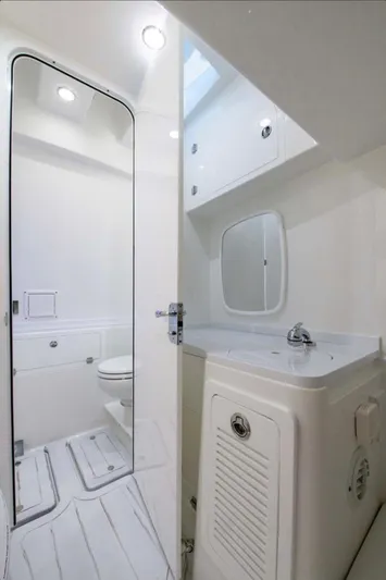  Yacht Photos Pics 2024 HCB 39 Speciale boat bathroom with modern fixtures and white interior.