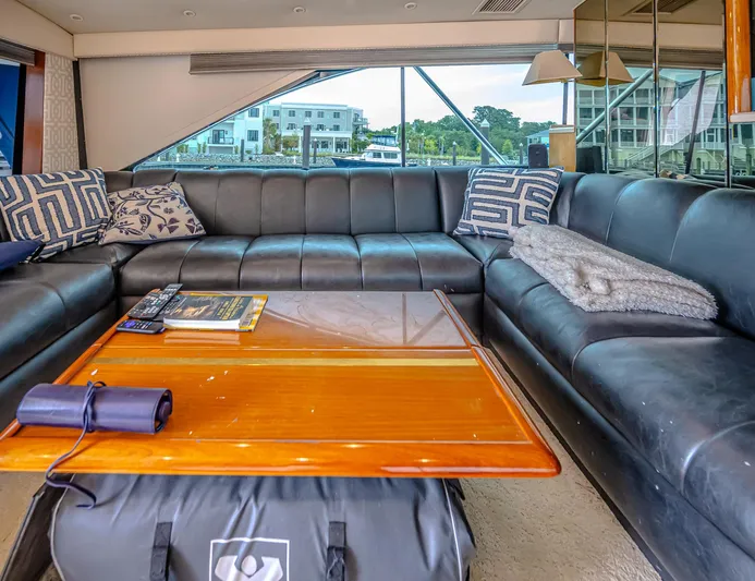 Double Down Yacht Photos Pics Luxurious interior of 1997 Ocean Yachts 60 Super Sport EB with leather seating and wooden table.