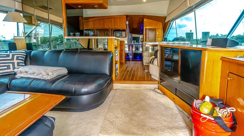 Double Down Yacht Photos Pics Luxurious interior of 1997 Ocean Yachts 60 Super Sport EB with leather seating and wood accents.