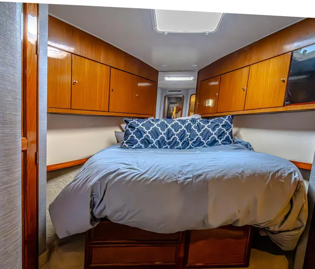 Double Down Yacht Photos Pics Luxurious cabin interior of 1997 Ocean Yachts 60 Super Sport EB with cozy bedding.