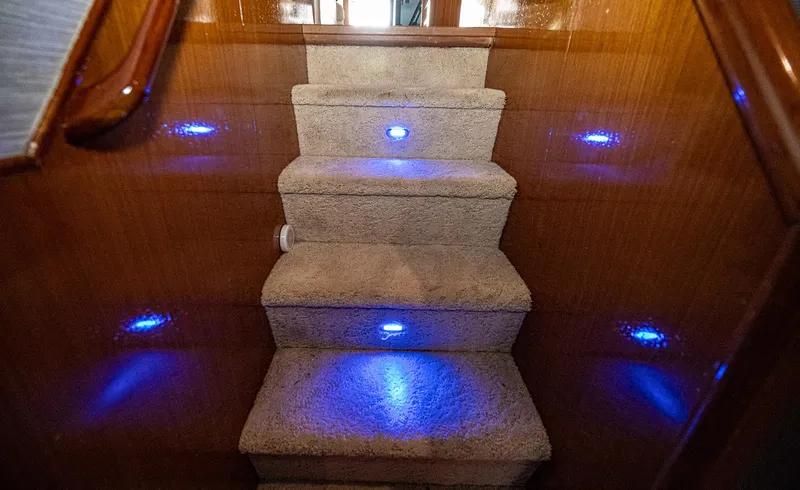 Double Down Yacht Photos Pics Carpeted yacht stairs with blue LED lights, Ocean Yachts 60 Super Sport EB, 1997 model.