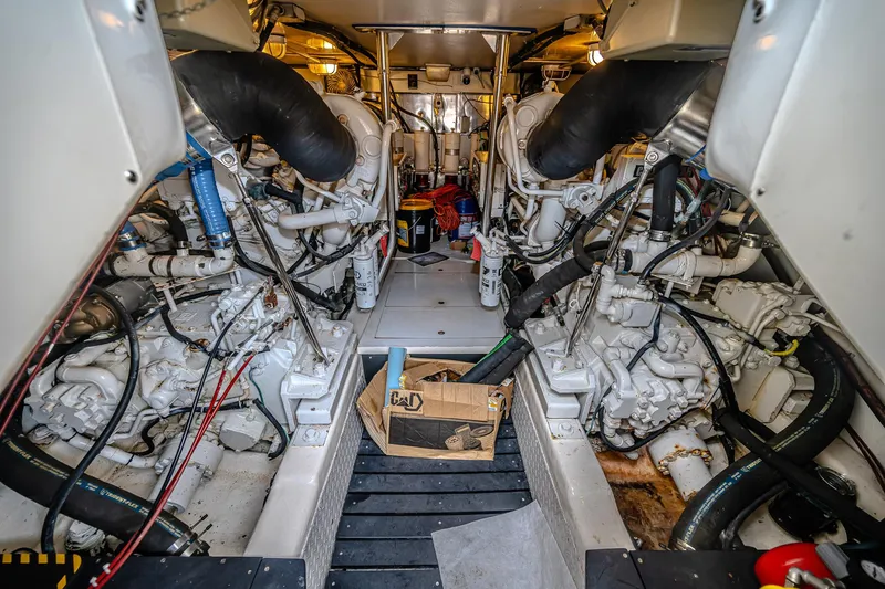 Double Down Yacht Photos Pics Engine room of 1997 Ocean Yachts 60 Super Sport EB, showcasing complex machinery and components.