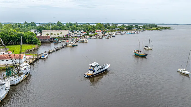 Double Down Yacht Photos Pics Aerial view of 1997 Ocean Yachts 60 Super Sport EB in a marina setting.