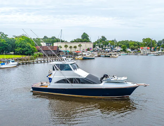 Double Down Yacht Photos Pics 1997 Ocean Yachts 60 Super Sport EB cruising in a scenic marina setting.