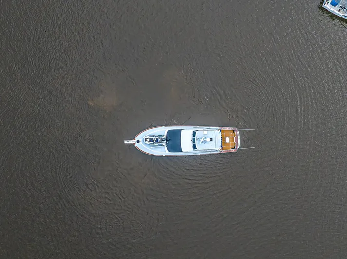Double Down Yacht Photos Pics Aerial view of 1997 Ocean Yachts 60 Super Sport EB on calm water.