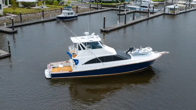 Double Down Yacht Photos Pics 1997 Ocean Yachts 60 Super Sport EB docked in a marina, featuring sleek design and fishing equipment.