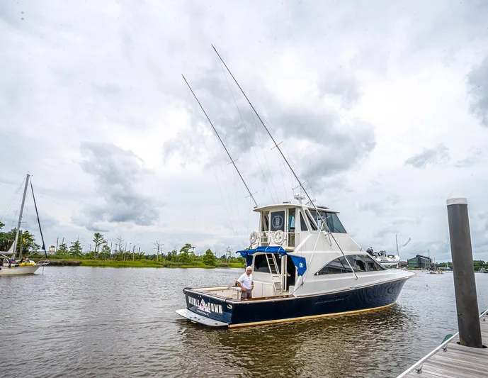Double Down Yacht Photos Pics 1997 Ocean Yachts 60 Super Sport EB docked on a cloudy day.