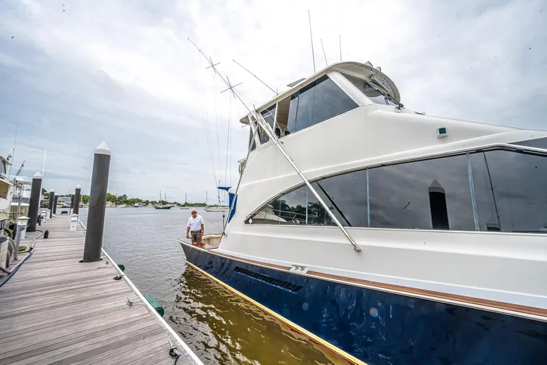 Double Down Yacht Photos Pics 1997 Ocean Yachts 60 Super Sport EB docked at marina with overcast sky.