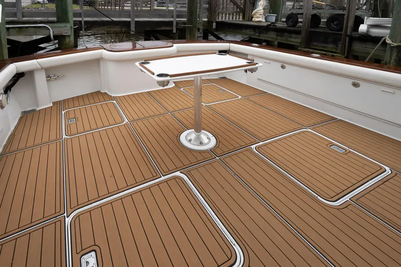 Double Down Yacht Photos Pics 1997 Ocean Yachts 60 Super Sport EB deck with teak flooring and table.