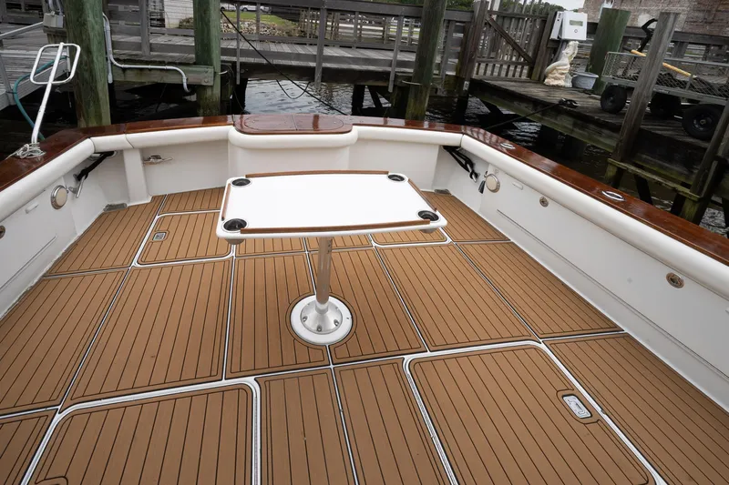 Double Down Yacht Photos Pics 1997 Ocean Yachts 60 Super Sport EB deck with table, docked at marina.