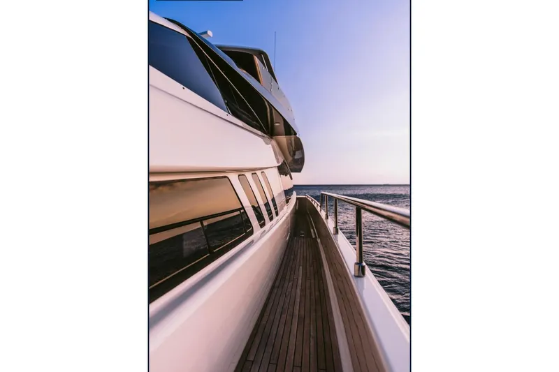 D & D Yacht Photos Pics Luxurious 2010 Ferretti Yachts 800 cruising at sunset on open sea.