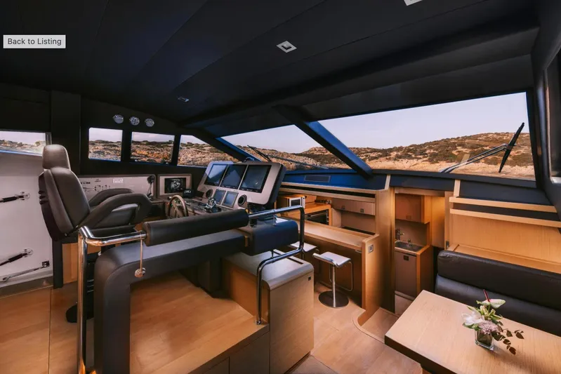 D & D Yacht Photos Pics Luxurious interior of 2010 Ferretti Yachts 800, featuring modern helm and seating area.