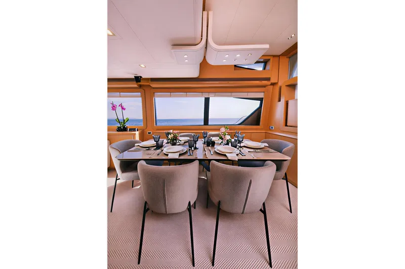 D & D Yacht Photos Pics Luxurious dining area on a 2010 Ferretti Yachts 800, featuring elegant table setting.