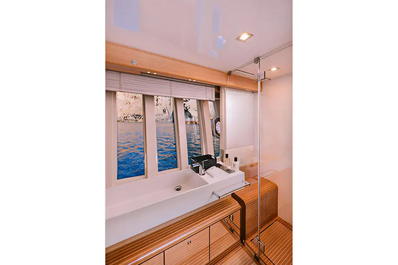 D & D Yacht Photos Pics Luxurious bathroom interior of 2010 Ferretti Yachts 800 with ocean view.