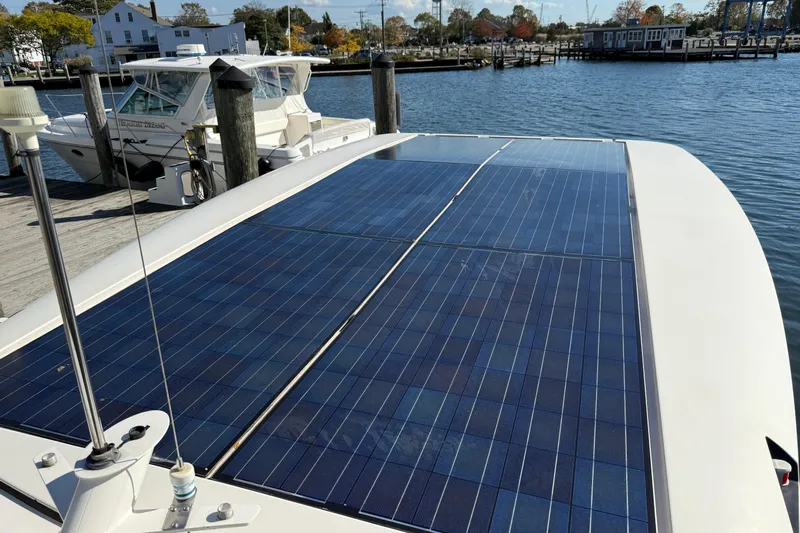 Landfall Yacht Photos Pics Solar panels on a 2013 Greenline 33 boat docked at a marina.