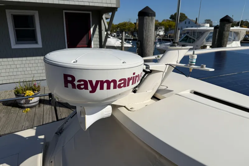 Landfall Yacht Photos Pics Raymarine radar on 2013 Greenline 33 boat docked near a wooden pier.