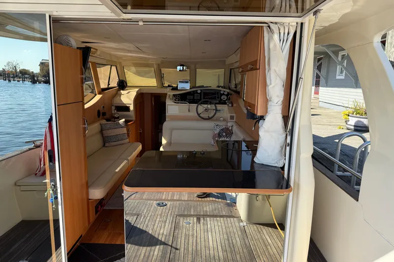 Landfall Yacht Photos Pics Interior view of 2013 Greenline 33 yacht, featuring modern design and comfortable seating.