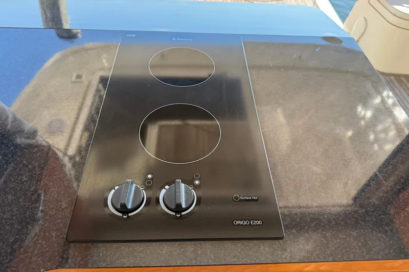 Landfall Yacht Photos Pics Ceramic cooktop on 2013 Greenline 33 yacht, featuring dual burners and control knobs.