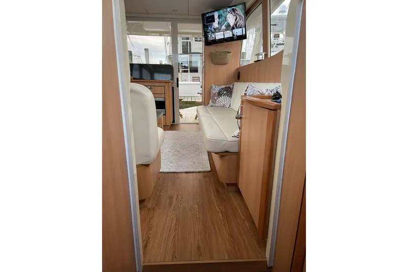 Landfall Yacht Photos Pics Interior of 2013 Greenline 33 yacht with modern furnishings and wood flooring.