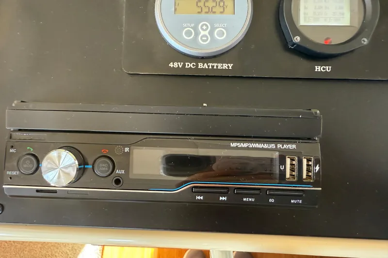 Landfall Yacht Photos Pics Audio system and control panel in a 2013 Greenline 33 boat, featuring USB ports and display.