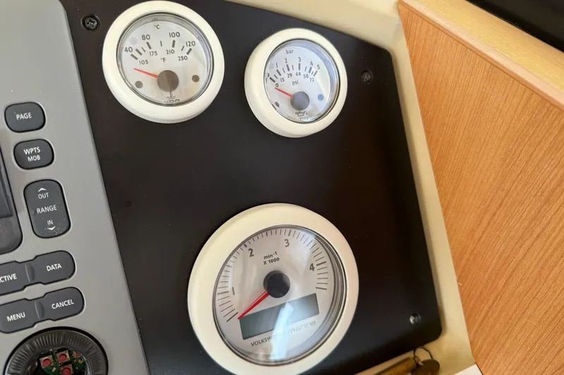 Landfall Yacht Photos Pics Instrument panel of a 2013 Greenline 33 boat with gauges and controls.