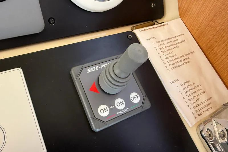 Landfall Yacht Photos Pics Control panel of a 2013 Greenline 33 boat with thruster joystick and instructions.