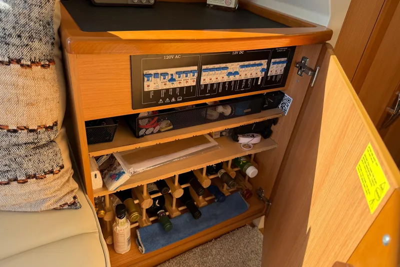 Landfall Yacht Photos Pics Electrical panel and storage cabinet inside a 2013 Greenline 33 boat.