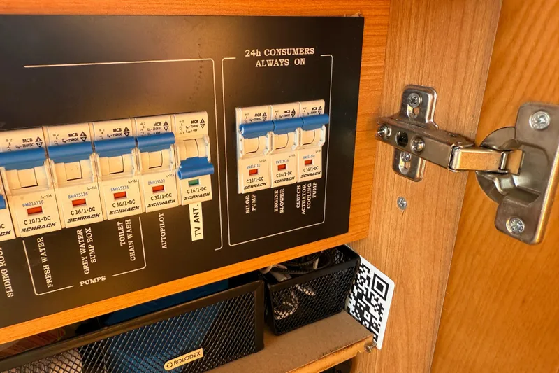 Landfall Yacht Photos Pics Electrical panel inside a 2013 Greenline 33 boat, featuring circuit breakers and labels.