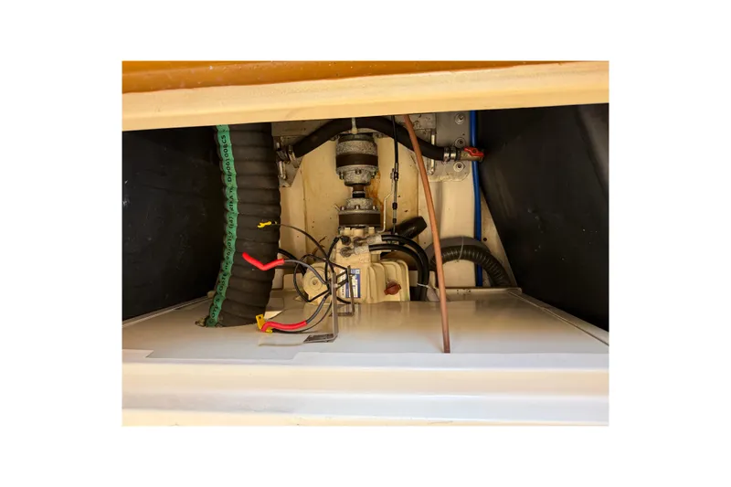 Landfall Yacht Photos Pics Engine compartment of a 2013 Greenline 33 boat, showing hoses and wiring.