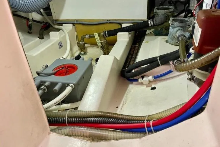 Landfall Yacht Photos Pics Engine room of 2013 Greenline 33 boat with visible hoses and components.