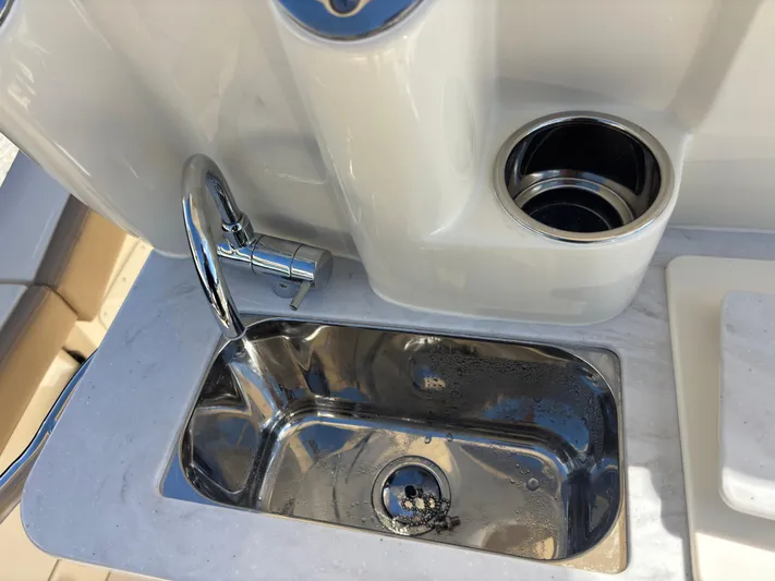  Yacht Photos Pics 2025 Scout 260 LXF boat sink with faucet and cup holder.