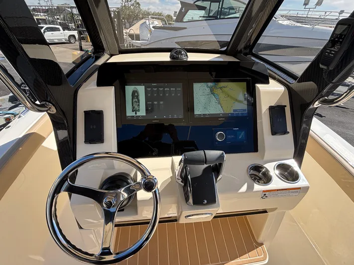  Yacht Photos Pics 2025 Scout 260 LXF boat dashboard with modern navigation and control systems.