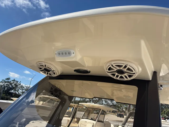  Yacht Photos Pics 2025 Scout 260 LXF boat speakers and roof detail under clear blue sky.