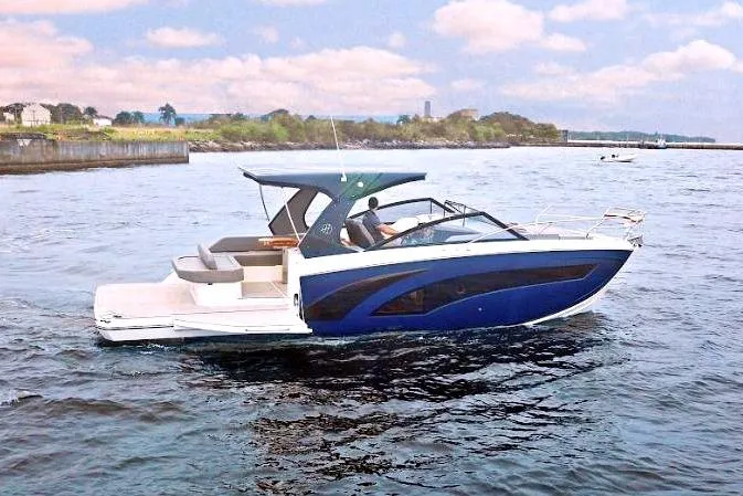 Custom Order Your 347 Today! Yacht Photos Pics 2025 Hanover 347 Inboard boat cruising on a calm lake under a partly cloudy sky.