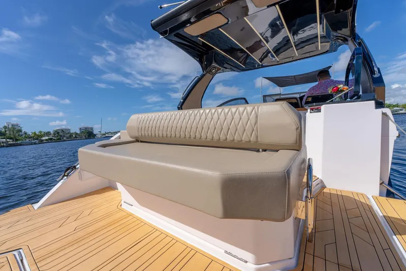 Custom Order Your 347 Today! Yacht Photos Pics Luxurious Hanover 347 boat interior with cushioned seating, 2026 model, on a sunny day.