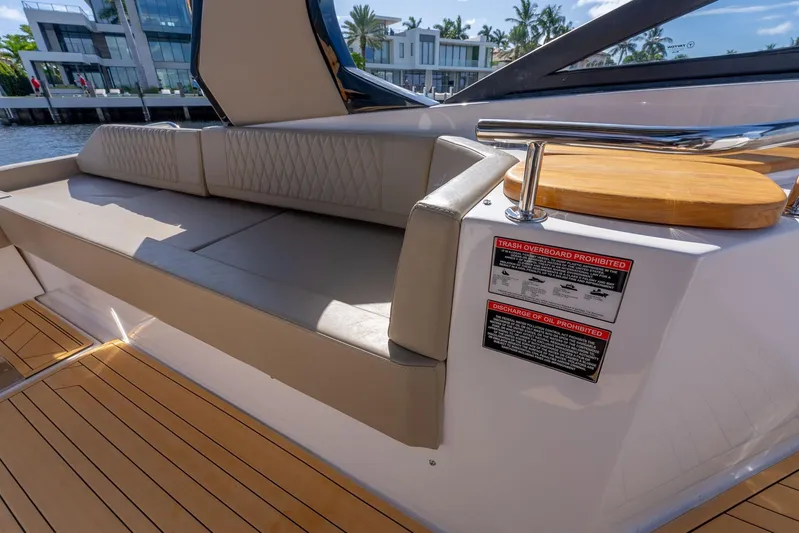 Custom Order Your 347 Today! Yacht Photos Pics Luxurious seating area on a 2026 Hanover 347 yacht with modern design and safety notices.