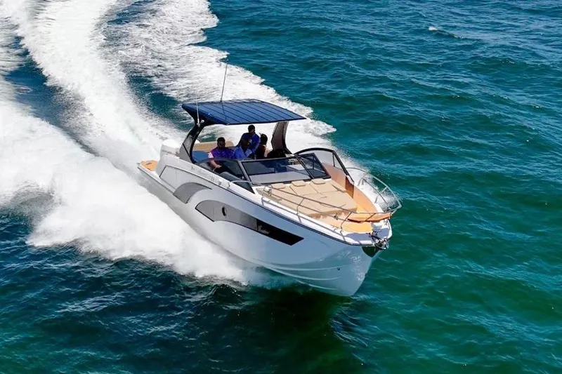 Custom Order Your 347 Today! Yacht Photos Pics 2026 Hanover 347 boat cruising on open water, creating a wake behind.