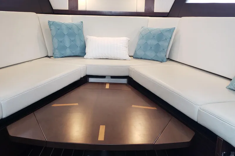  Yacht Photos Pics Interior of 2016 Monterey 360 Sport Coupe with elegant seating and decorative cushions.