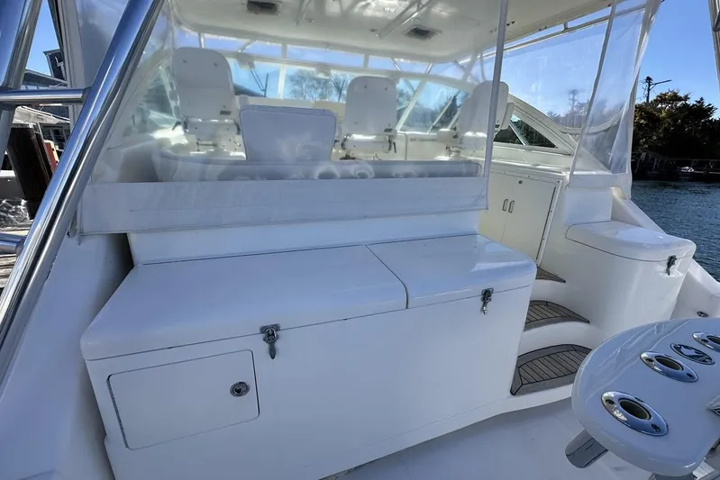 Moving Violation Yacht Photos Pics 2008 Cabo 40 boat interior with white seating and storage compartments.