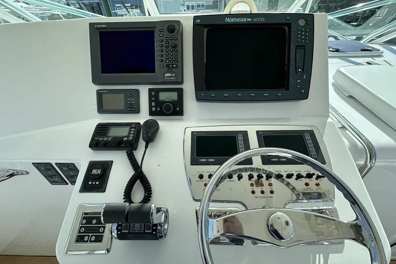 Moving Violation Yacht Photos Pics Control panel of a 2008 Cabo 40 boat with navigation and communication equipment.