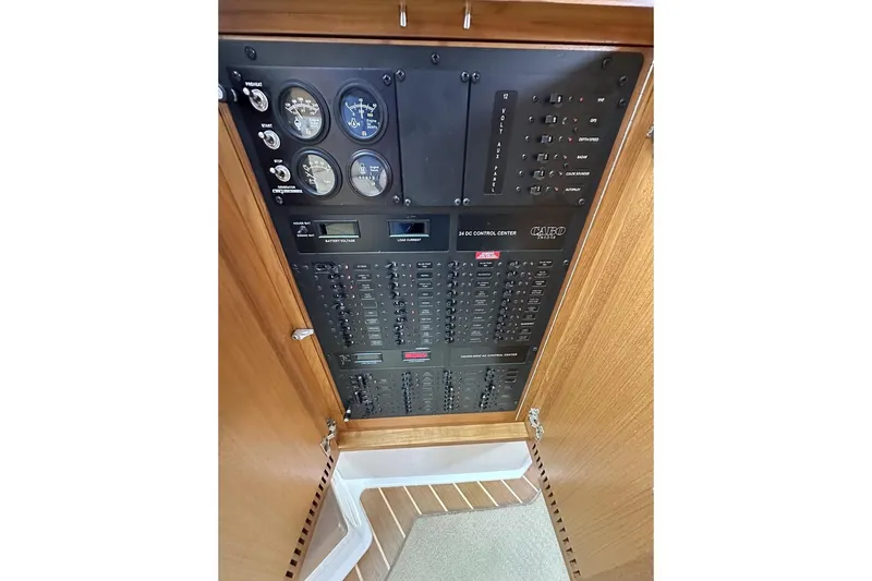 Moving Violation Yacht Photos Pics Control panel of a 2008 Cabo 40 boat with gauges and switches.