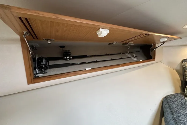 Moving Violation Yacht Photos Pics Fishing rod storage in 2008 Cabo 40 boat interior cabinet.